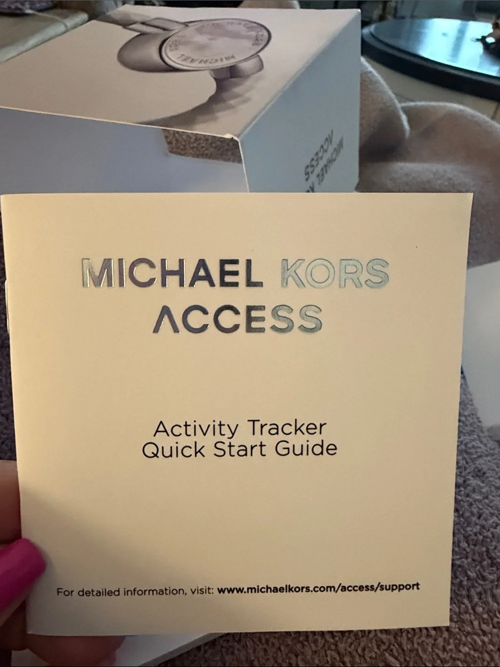 Michael Kors white braided activity tracker with silver-tone case